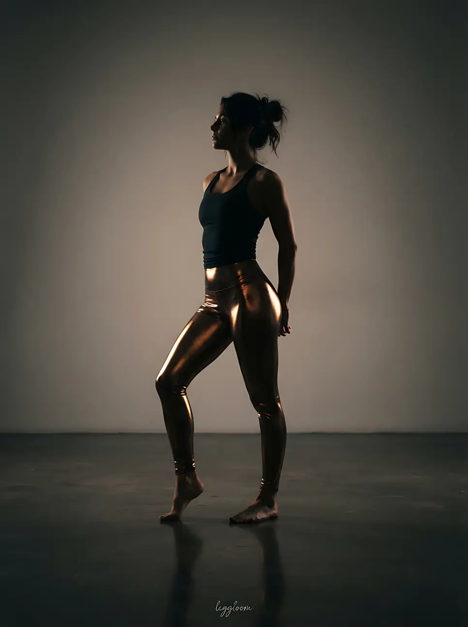 Figure lit against a dark studio backdrop.